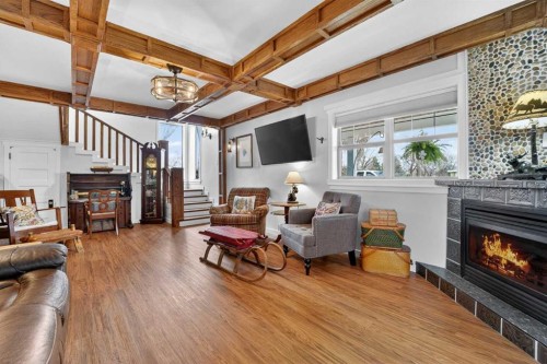 4717 2 Street West, Claresholm, AB - Indoor Photo Showing Living Room With Fireplace