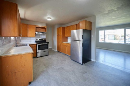 2501 13 Avenue North, Lethbridge, AB - Indoor Photo Showing Kitchen With Double Sink