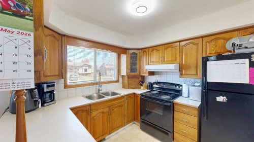 2119 17A Avenue, Coaldale, AB - Indoor Photo Showing Kitchen With Double Sink