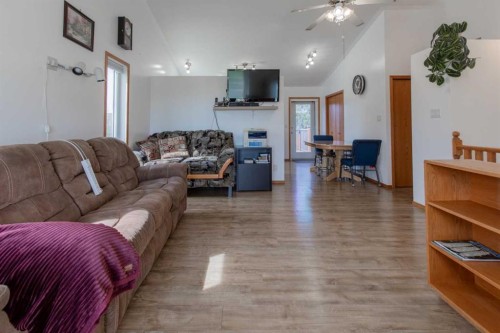 1118 25 Avenue, Coaldale, AB - Indoor Photo Showing Living Room With Fireplace