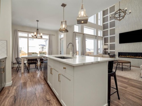 653 Aquitania Boulevard West, Lethbridge, AB - Indoor Photo Showing Kitchen With Fireplace With Upgraded Kitchen