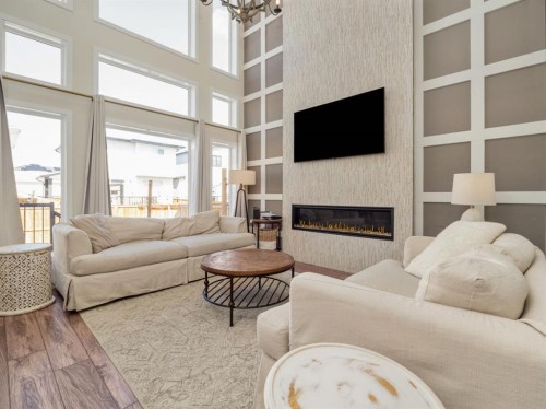 653 Aquitania Boulevard West, Lethbridge, AB - Indoor Photo Showing Living Room With Fireplace