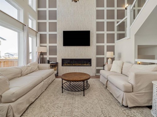 653 Aquitania Boulevard West, Lethbridge, AB - Indoor Photo Showing Living Room With Fireplace