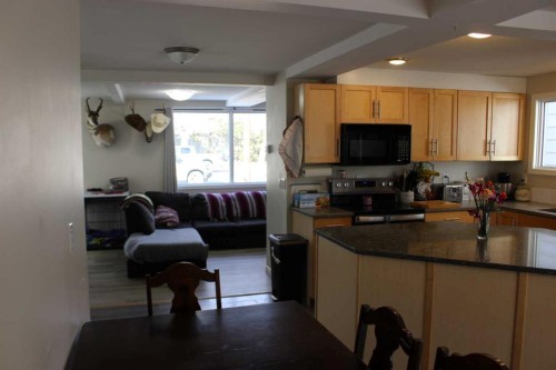 1607 23 Avenue, Coaldale, AB - Indoor Photo Showing Kitchen With Double Sink