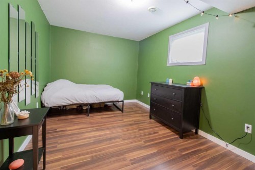 241 N 250 E, Raymond, AB - Indoor Photo Showing Bedroom