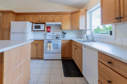 241 N 250 E, Raymond, AB - Indoor Photo Showing Kitchen With Double Sink
