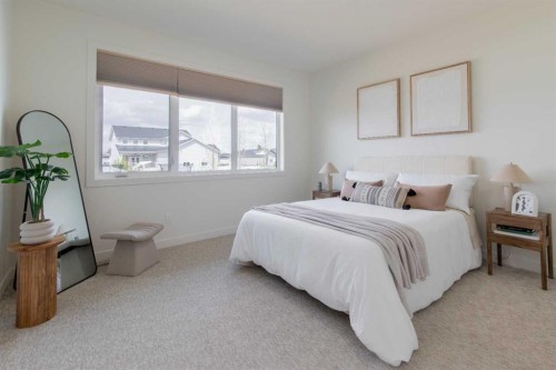306 Bridge Crossing Close, Raymond, AB - Indoor Photo Showing Bedroom