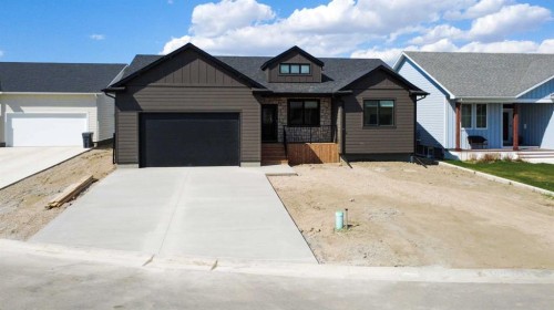 306 Bridge Crossing Close, Raymond, AB - Outdoor With Facade