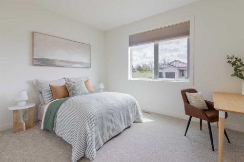 306 Bridge Crossing Close, Raymond, AB - Indoor Photo Showing Bedroom