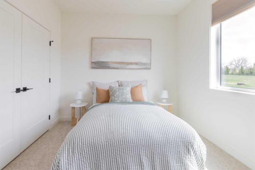306 Bridge Crossing Close, Raymond, AB - Indoor Photo Showing Bedroom