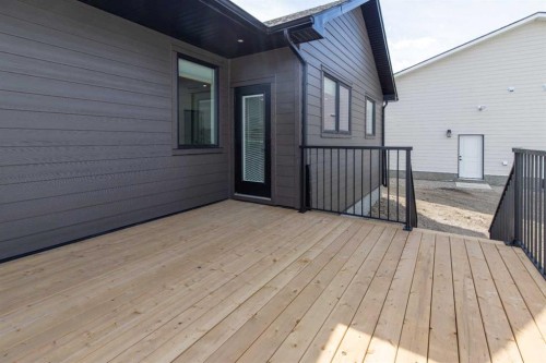 306 Bridge Crossing Close, Raymond, AB - Outdoor With Deck Patio Veranda With Exterior