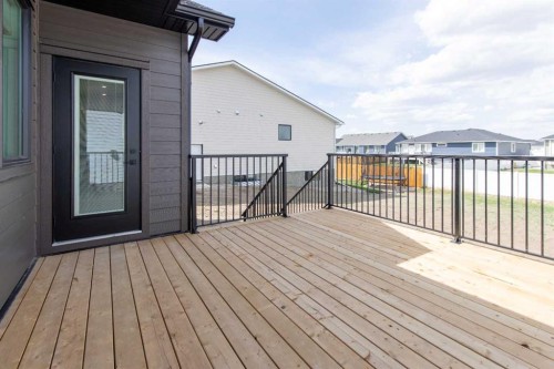 306 Bridge Crossing Close, Raymond, AB - Outdoor With Deck Patio Veranda With Exterior