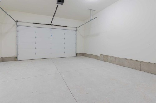 306 Bridge Crossing Close, Raymond, AB - Indoor Photo Showing Garage