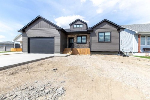 306 Bridge Crossing Close, Raymond, AB - Outdoor With Facade