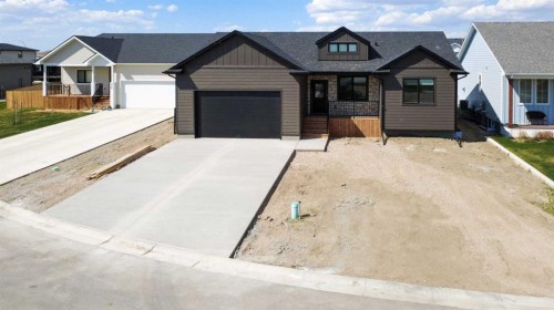 306 Bridge Crossing Close, Raymond, AB - Outdoor With Facade