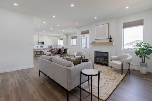 306 Bridge Crossing Close, Raymond, AB - Indoor Photo Showing Living Room With Fireplace
