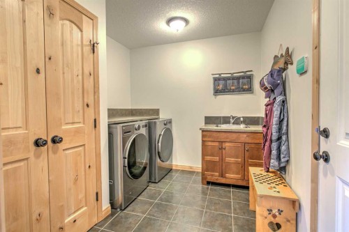 100 Canyoncrest Point West, Lethbridge, AB - Indoor Photo Showing Laundry Room