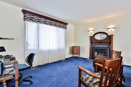 86 Chippewa Crescent West, Lethbridge, AB - Indoor Photo Showing Office With Fireplace