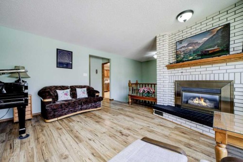 31 Red Crow Boulevard West, Lethbridge, AB - Indoor Photo Showing Living Room With Fireplace