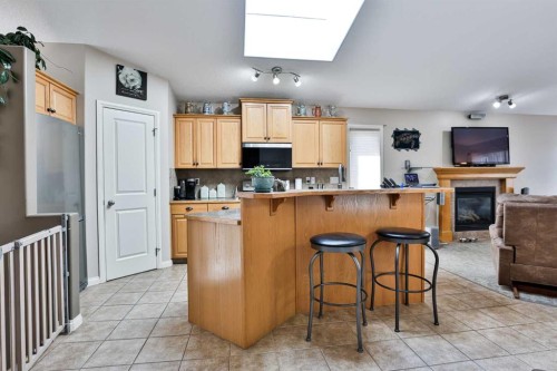 499 Lynx Crescent North, Lethbridge, AB - Indoor Photo Showing Kitchen With Fireplace
