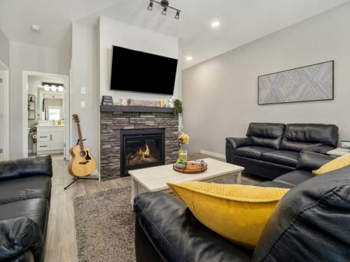 4-322 Northlander Bend West, Lethbridge, AB - Indoor Photo Showing Living Room With Fireplace