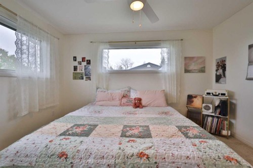47 S 200 W, Raymond, AB - Indoor Photo Showing Bedroom