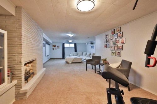 47 S 200 W, Raymond, AB - Indoor Photo Showing Other Room With Fireplace