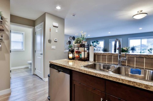 2-37 Cougar Cove North, Lethbridge, AB - Indoor Photo Showing Kitchen With Double Sink