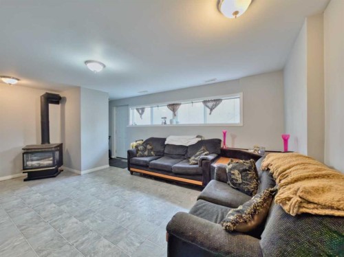 13553 18 Avenue, Blairmore, AB - Indoor Photo Showing Living Room With Fireplace