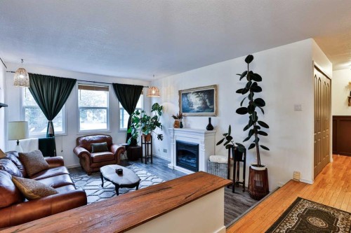 203 Ryerson Road West, Lethbridge, AB - Indoor Photo Showing Living Room With Fireplace
