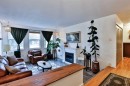 203 Ryerson Road West, Lethbridge, AB  - Indoor Photo Showing Living Room With Fireplace 