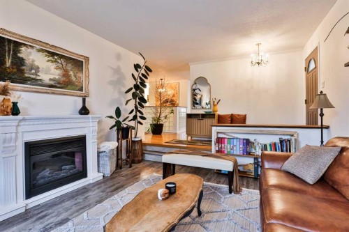 203 Ryerson Road West, Lethbridge, AB - Indoor Photo Showing Living Room With Fireplace
