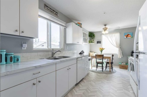 57 Honeysuckle Road North, Lethbridge, AB - Indoor Photo Showing Kitchen With Double Sink