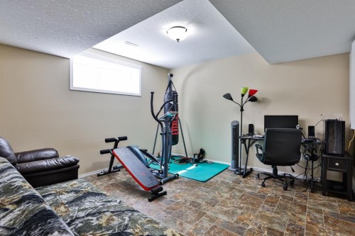 557 Mary Cameron Crescent North, Lethbridge, AB - Indoor Photo Showing Gym Room