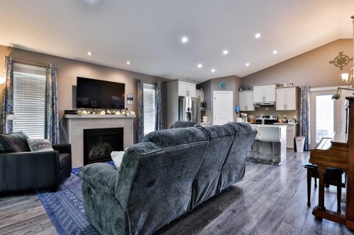 223 Couleesprings Terrace South, Lethbridge, AB - Indoor Photo Showing Living Room With Fireplace