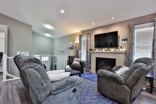 223 Couleesprings Terrace South, Lethbridge, AB - Indoor Photo Showing Living Room With Fireplace