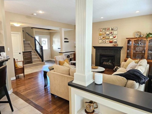 230 Firelight Crescent West, Lethbridge, AB - Indoor Photo Showing Living Room With Fireplace