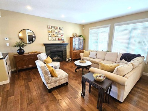 230 Firelight Crescent West, Lethbridge, AB - Indoor Photo Showing Living Room With Fireplace