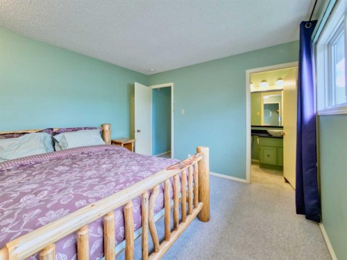 8126 20 Avenue, Coleman, AB - Indoor Photo Showing Bedroom