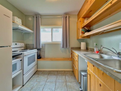 8126 20 Avenue, Coleman, AB - Indoor Photo Showing Kitchen With Double Sink