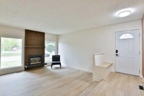 418 Dieppe Boulevard South, Lethbridge, AB - Indoor Photo Showing Living Room With Fireplace