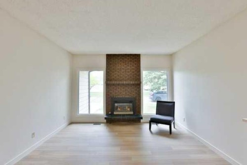 418 Dieppe Boulevard South, Lethbridge, AB - Indoor Photo Showing Living Room With Fireplace