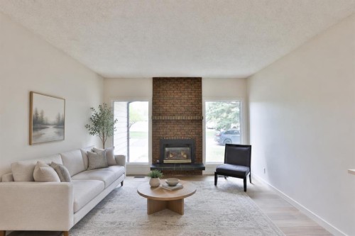 418 Dieppe Boulevard South, Lethbridge, AB - Indoor Photo Showing Living Room With Fireplace