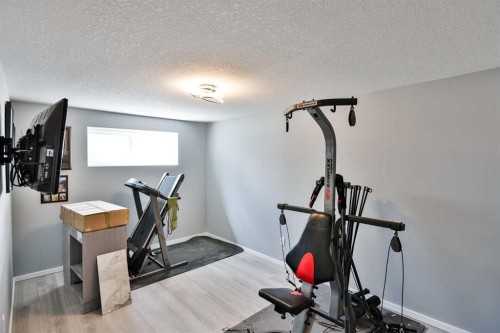 14 Thyrza Burkitt Place North, Lethbridge, AB - Indoor Photo Showing Gym Room