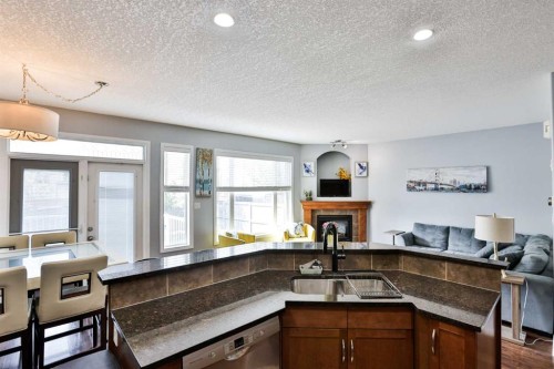 14 Thyrza Burkitt Place North, Lethbridge, AB - Indoor Photo Showing Kitchen With Double Sink