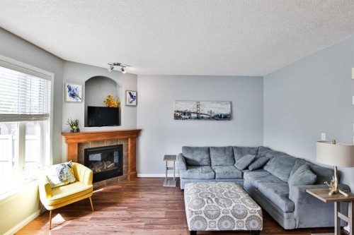 14 Thyrza Burkitt Place North, Lethbridge, AB - Indoor Photo Showing Living Room With Fireplace