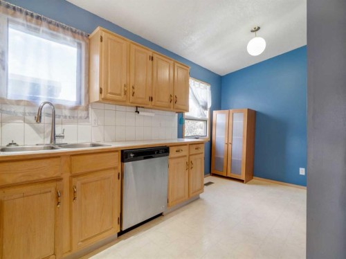 120S 300E, Raymond, AB - Indoor Photo Showing Kitchen With Double Sink