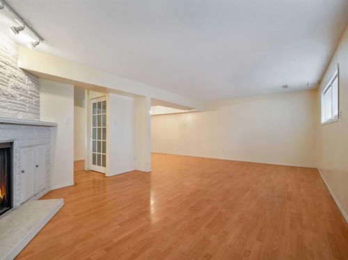 120S 300E, Raymond, AB - Indoor Photo Showing Other Room With Fireplace