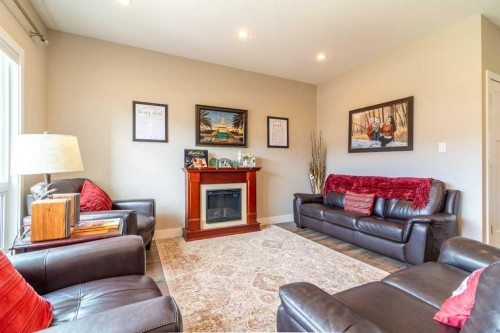 679 Keystone Chase West, Lethbridge, AB - Indoor Photo Showing Living Room With Fireplace