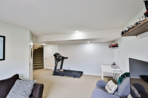 573 Squamish Lane West, Lethbridge, AB - Indoor Photo Showing Gym Room